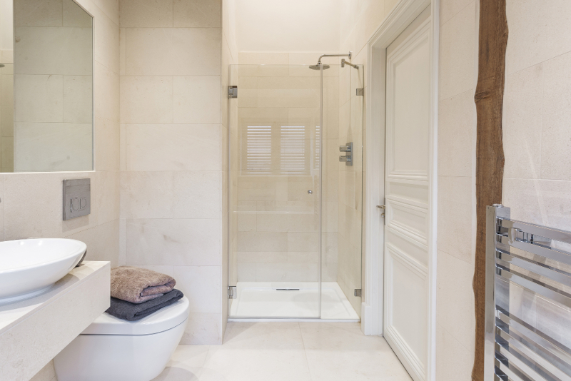 Amazing Frameless Shower Enclosures made to your specifications including for sloping ceilings